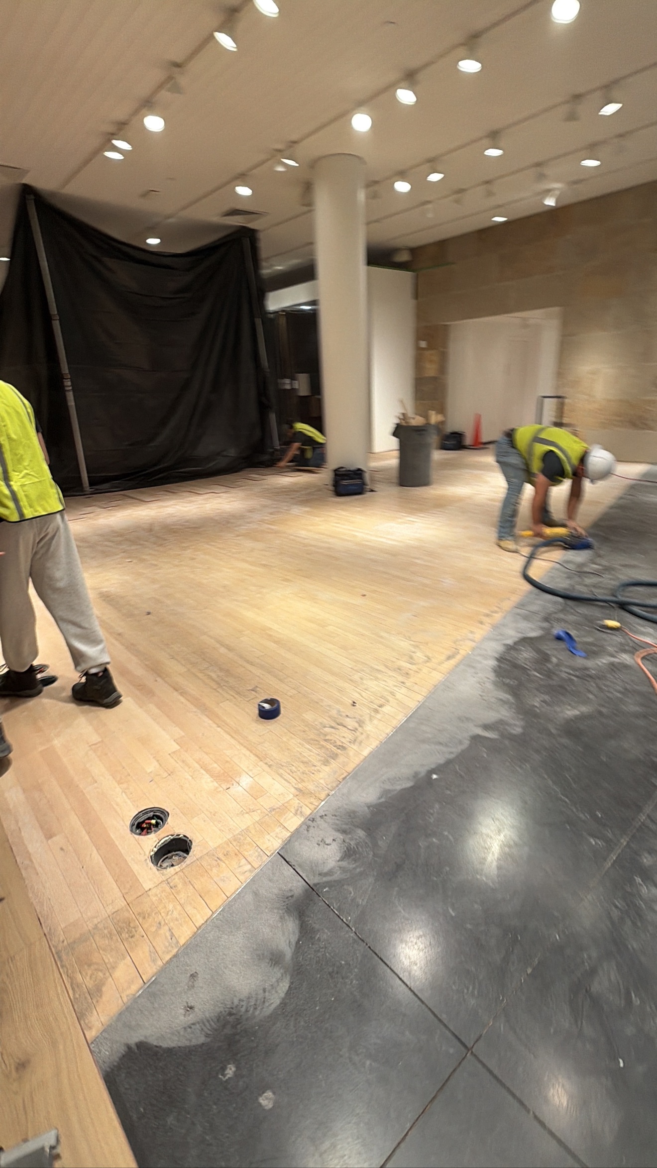 Top Flooring crew working on a commercial wood floor installation