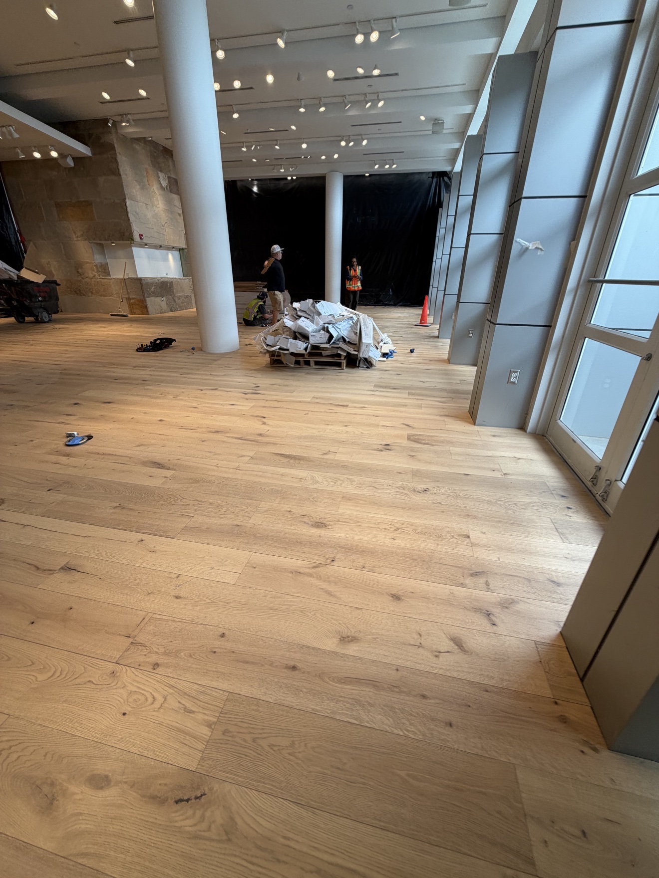 Engineered wood flooring being installed in a commercial interior