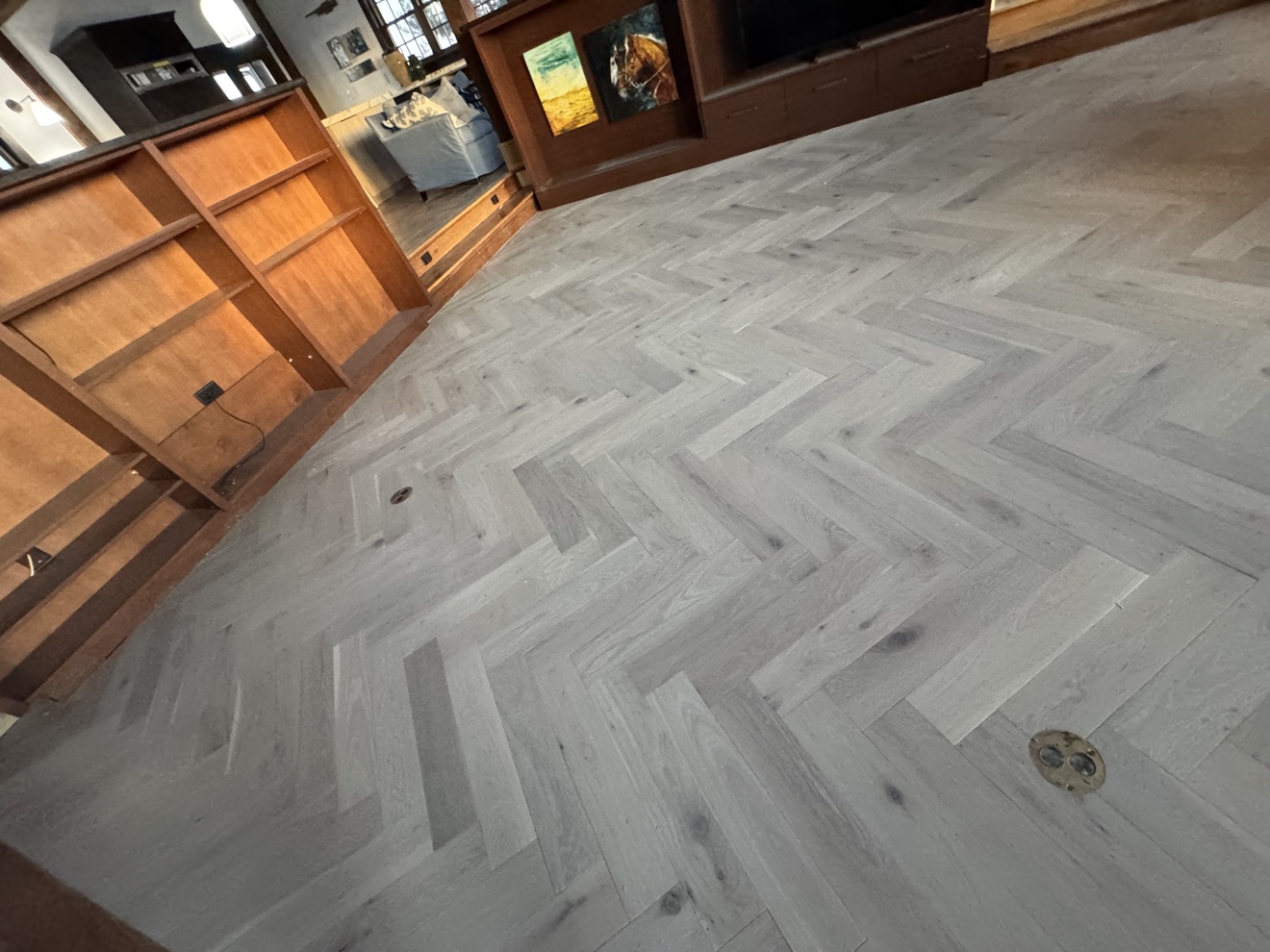 Custom herringbone wood floor installed by Top Flooring