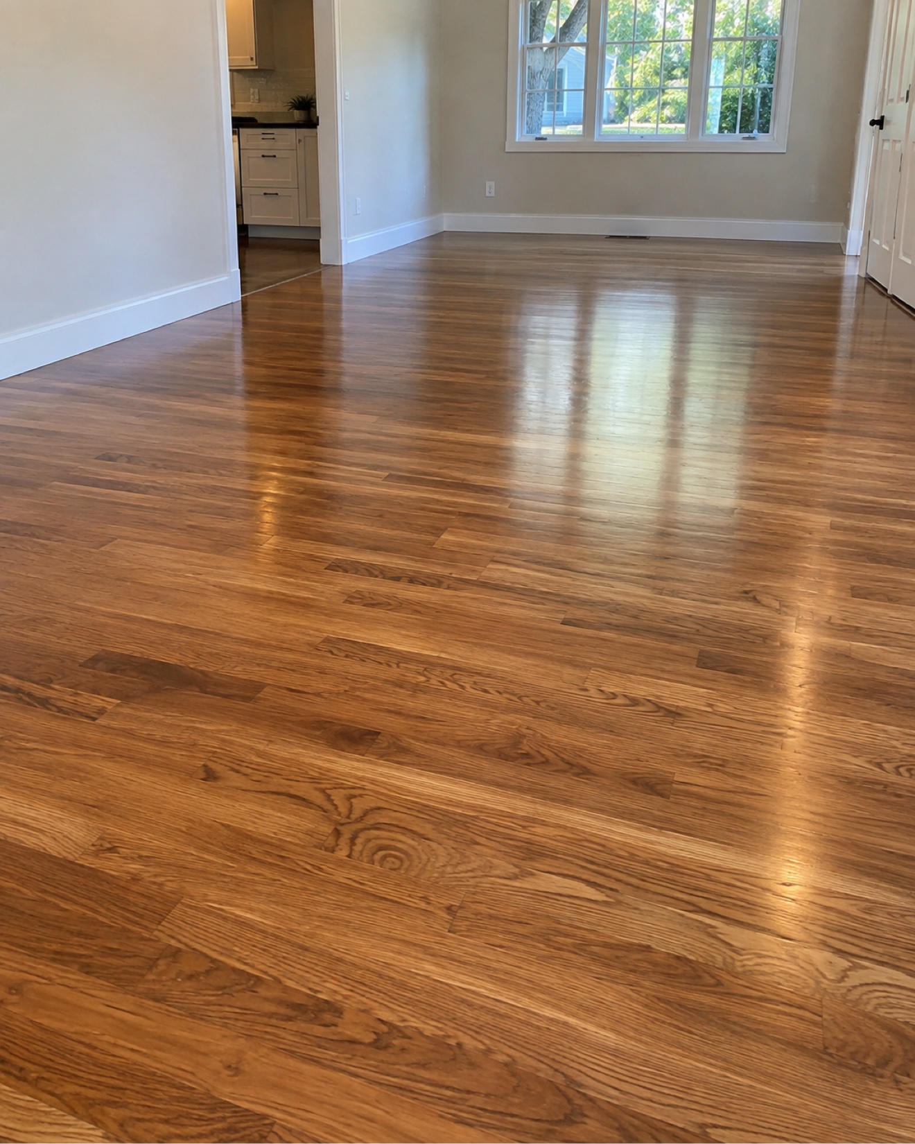 Refinished natural oak floor in a bright residential room