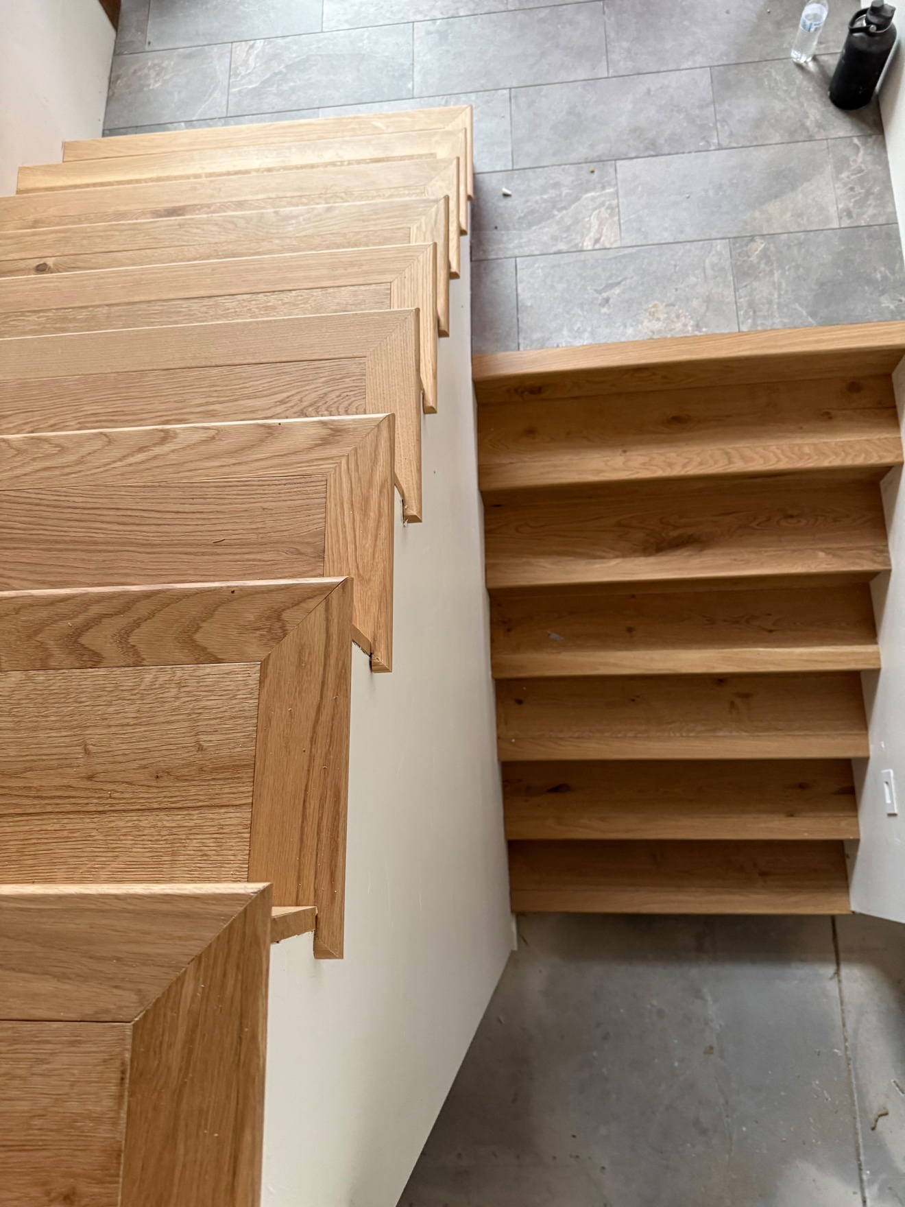 Custom white oak staircase built by Top Flooring